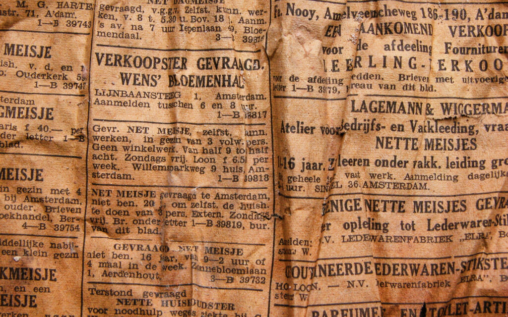 Snapshot of Vintage Newsprint in Enigmatic Script: An Artistic Capture of Past and Language Wallpaper
