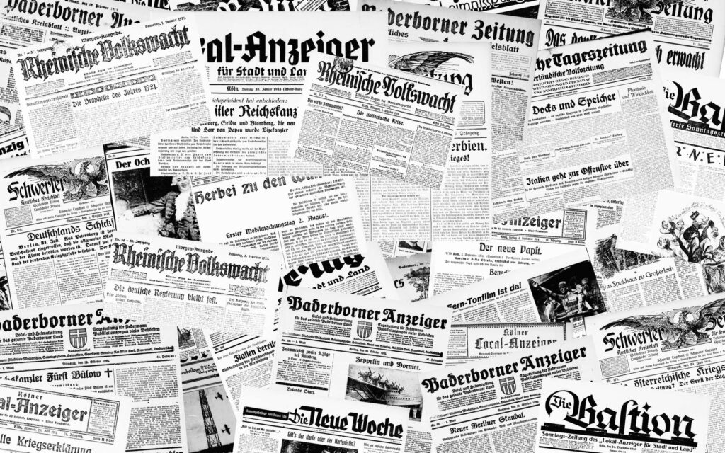 Vintage Newspaper Black and White Wallpaper: Antique Clippings Background