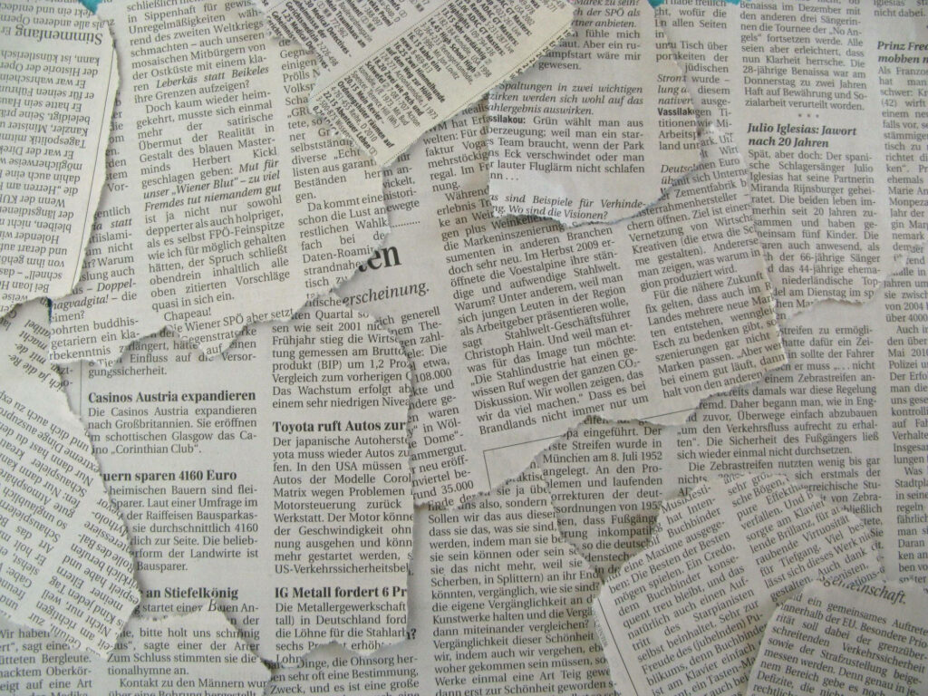 Vintage Collage: Aesthetic Wallpaper of Hand-Torn Newspaper Sheets