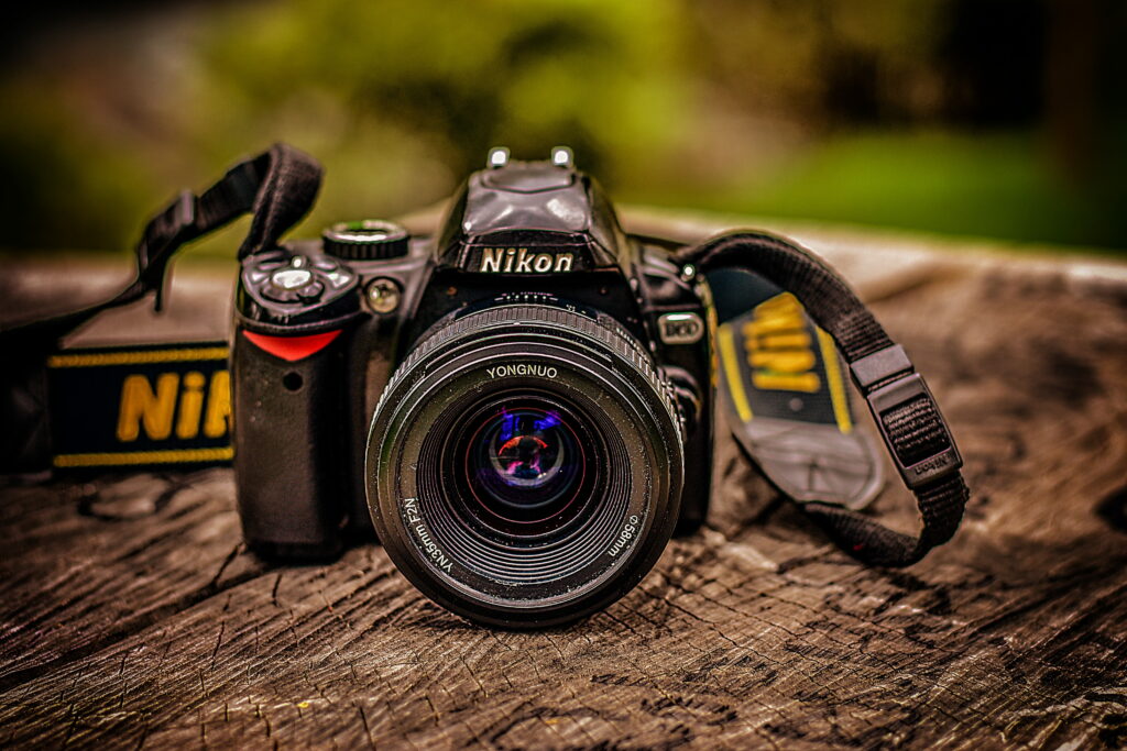 Vintage Nikon DSLR - Capturing Retro Photography Themes Wallpaper