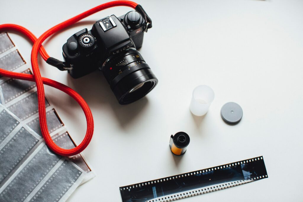 Vintage Photography Wallpaper: Black Camera & Red Strap Aesthetic