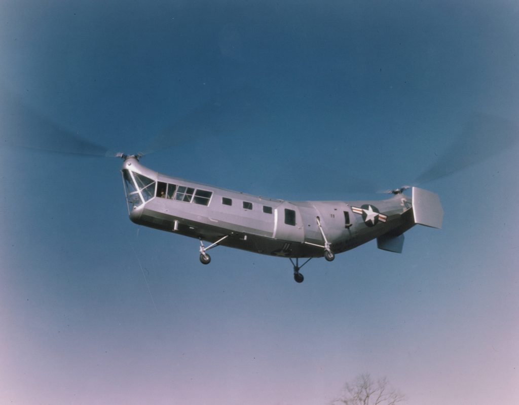 Vintage Piasecki HRP-1 Rescuer helicopter tandem rotor design flying against blue sky wallpaper