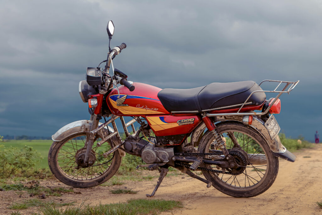 Vintage Red Bike Wallpaper: Nostalgic Charm on a Rural Path
