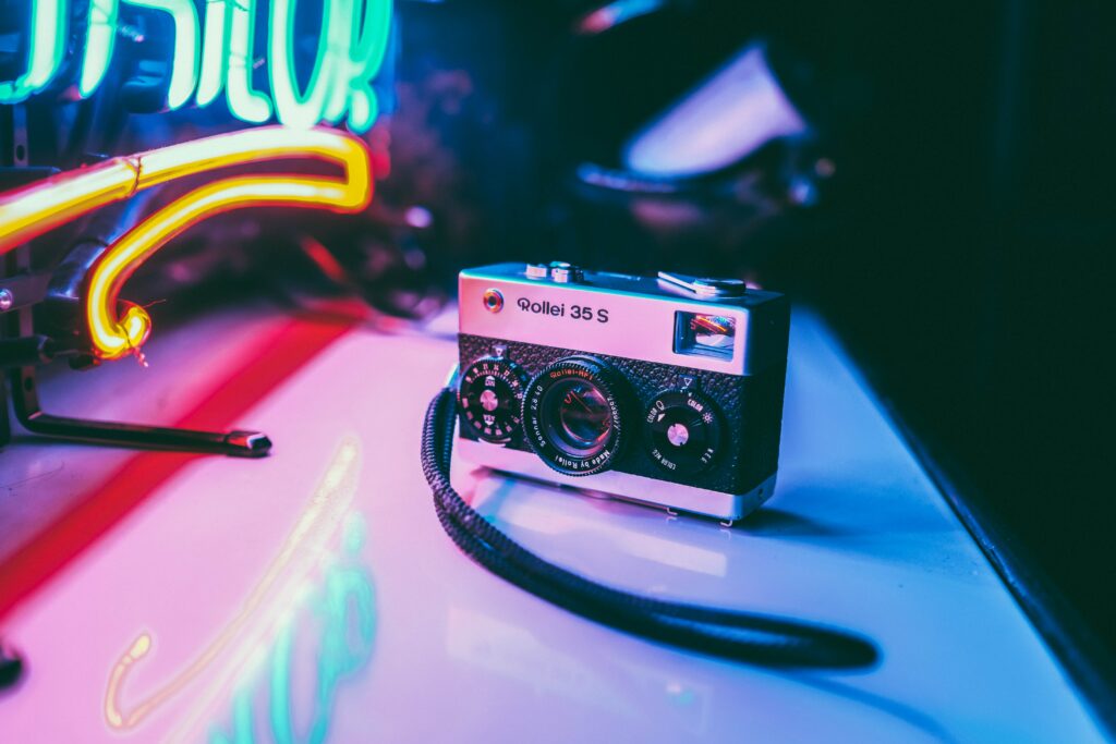 Vintage Rollei 35 S Camera Wallpaper - Retro Neon Aesthetic