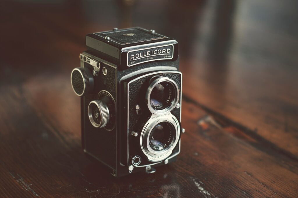 Vintage Rolleicord Camera on Wood - Retro Wallpaper Background