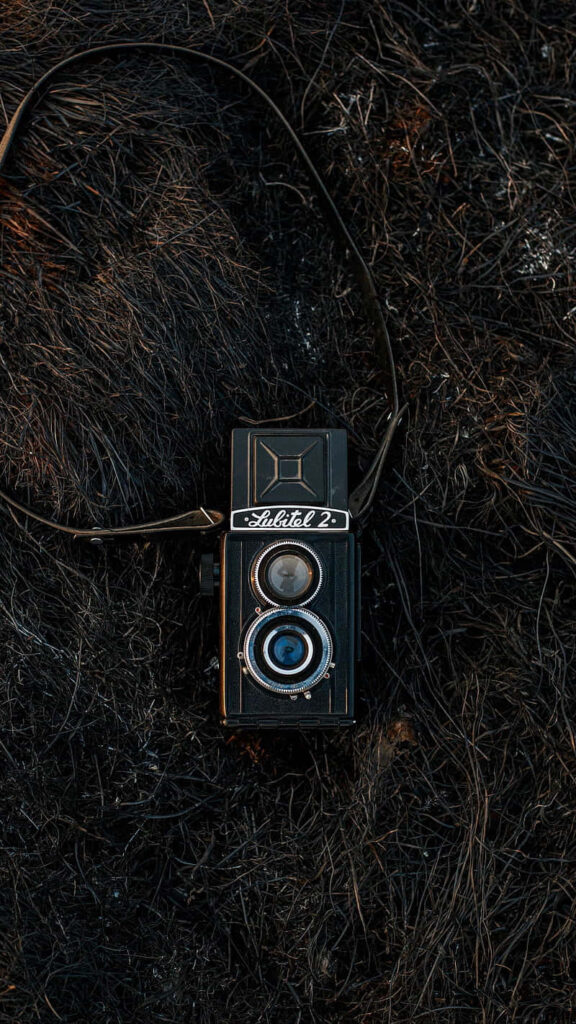 Vintage Rotary Dial Phone Wallpaper on Textured Dark Background