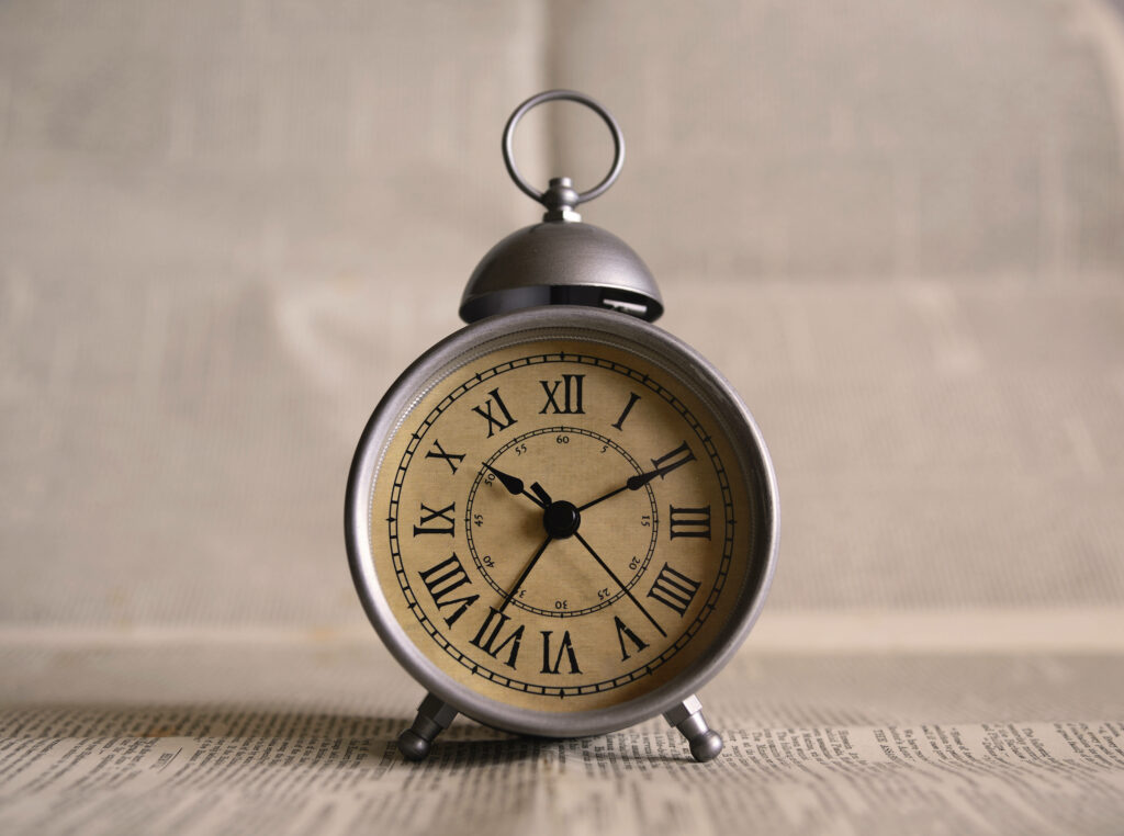 Timeless Vintage Silver Clock with Roman Numerals - Elegant Wallpaper