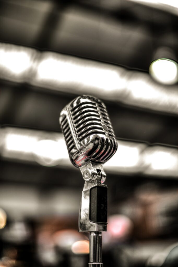 Vintage Silver Microphone Wallpaper: Elegant Blurred Background