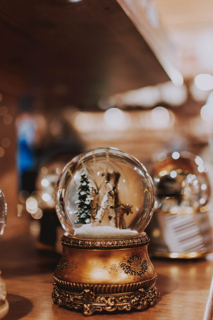 Intricate Snow Globe Wallpaper: Vintage Winter Scene Background