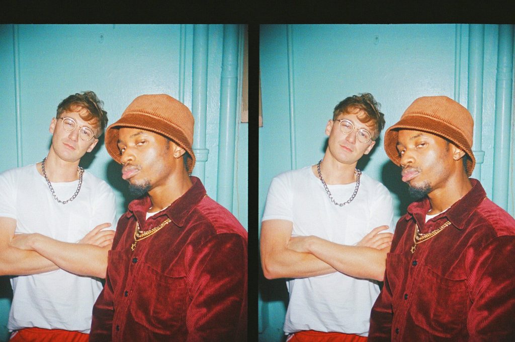 Vintage style wallpaper featuring Glass Animals Dave Bayley and rapper Denzel Curry split-frame portrait