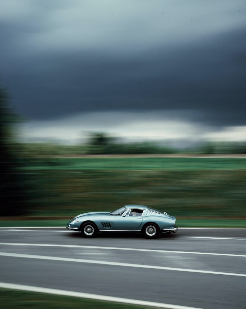Retro Sports Car in Motion - Dynamic Wallpaper for Speed Lovers
