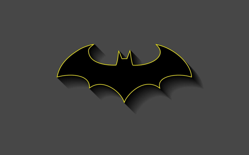 Defining the Dark Knight: A Classic Yellow Outlined Batman Logo Against a Gray Wallpaper