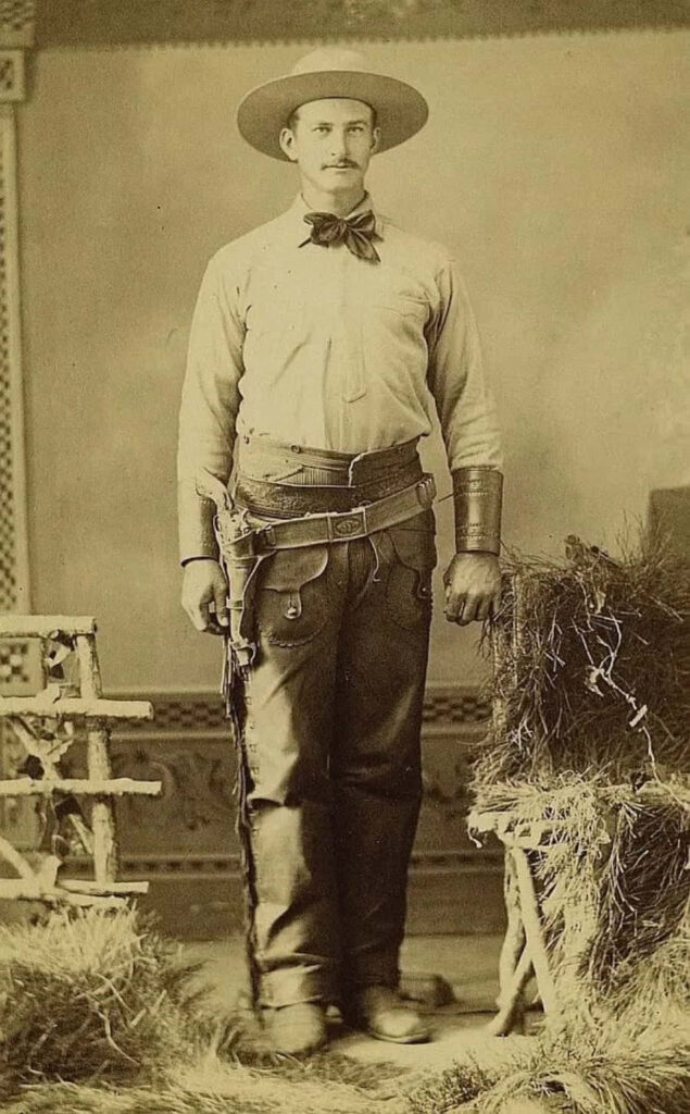 Vintage cowboy wallpaper with sepia tones classic Western attire and historic American frontier style