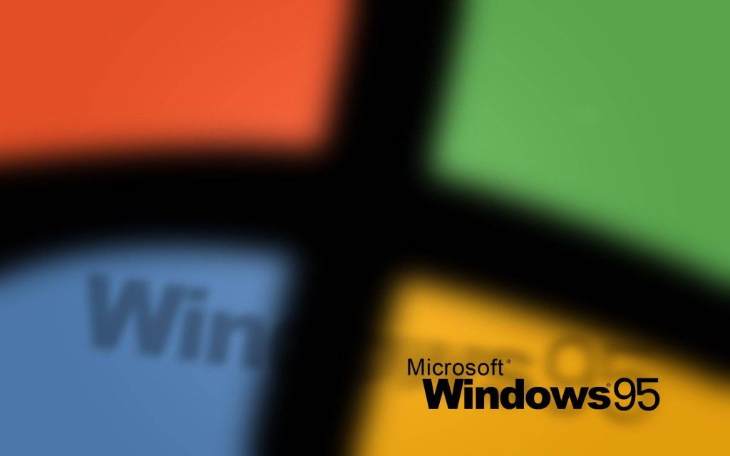 Vintage Windows 95 wallpaper with iconic logo and blurred red green blue yellow flag colors background