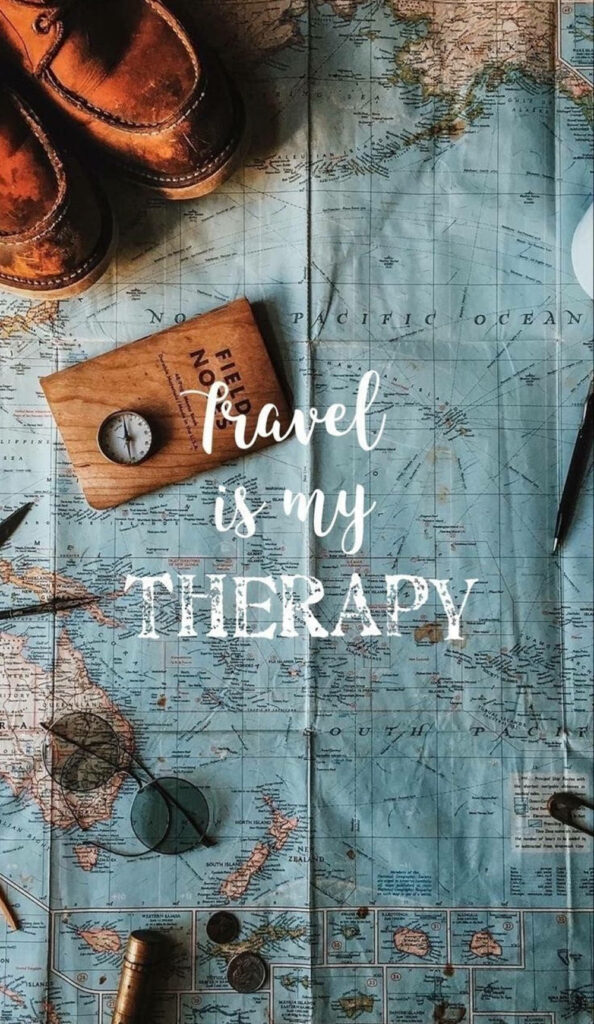 Vintage world map wallpaper with compass leather shoes notebook and travel is my therapy quote