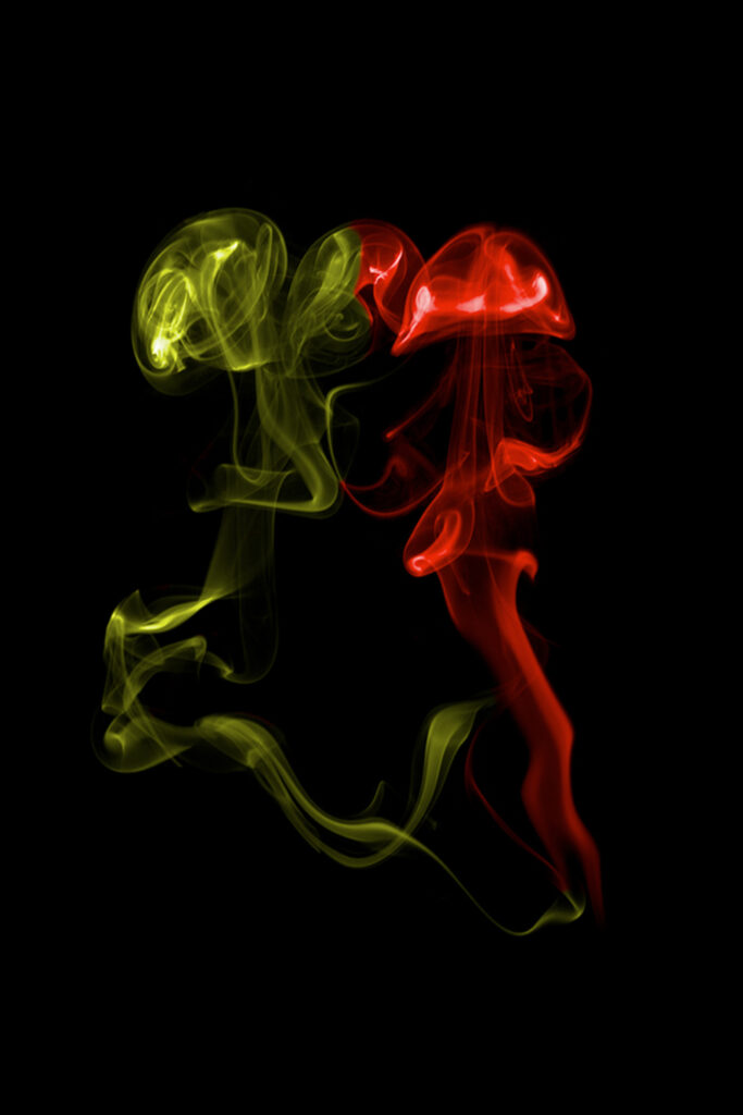Vivid Smoke Trail Wallpaper: Abstract Artwork on Dark Background