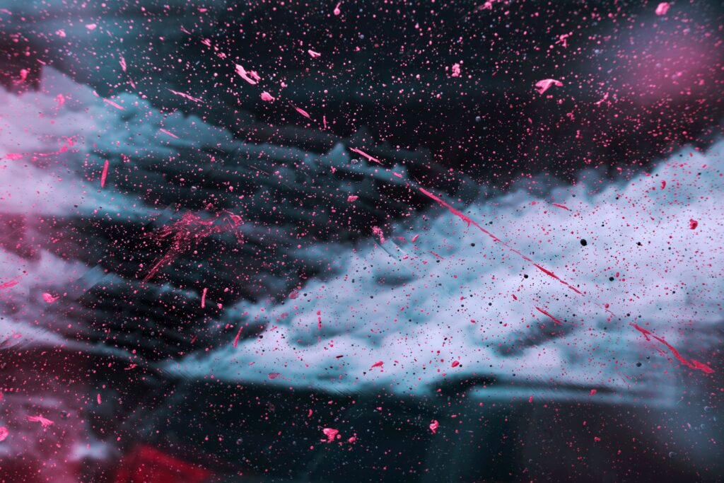 Vivid Abstract Wallpaper: Dynamic Paint Splashes on Dark Background