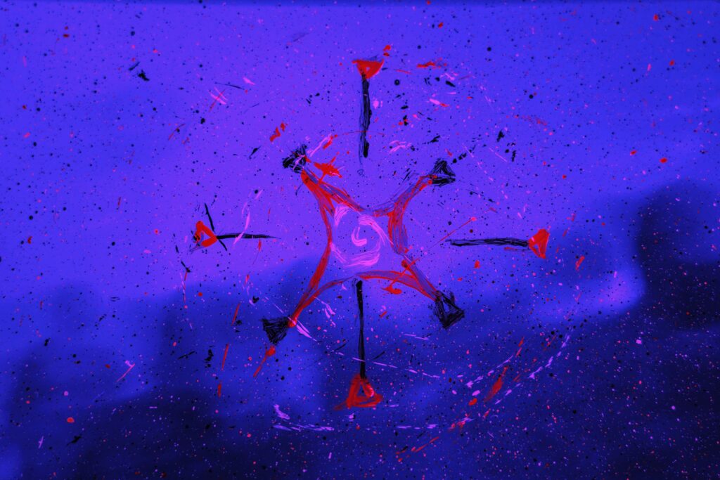 Vibrant Purple and Red Abstract Wallpaper with Paint Splashes