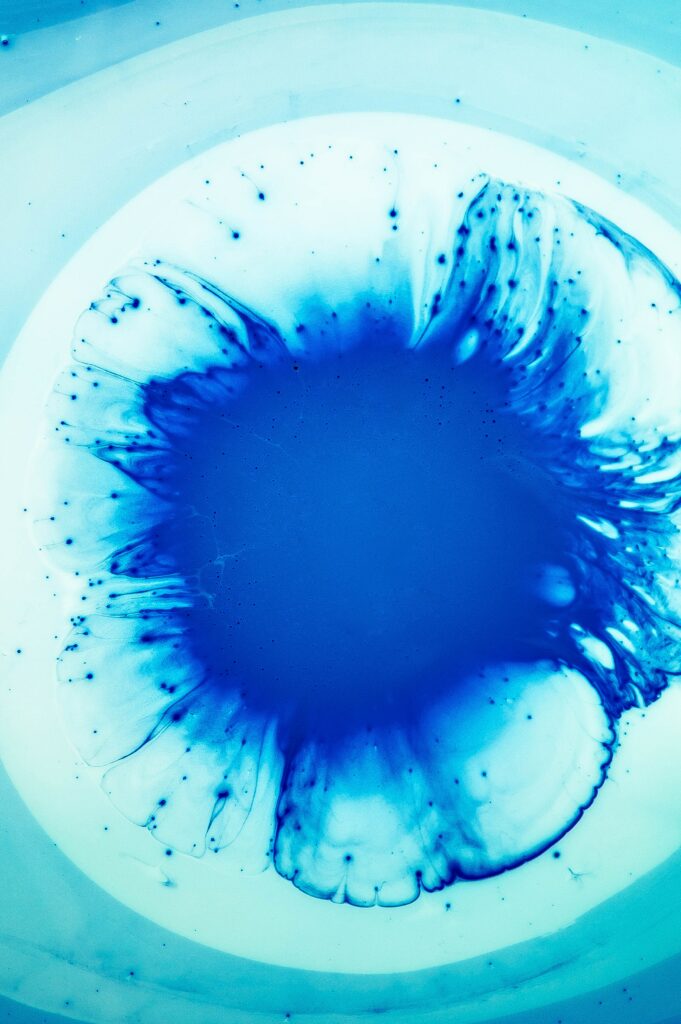 Vivid Blue Abstract Wallpaper: Fluid Liquid Stains on Soft Background
