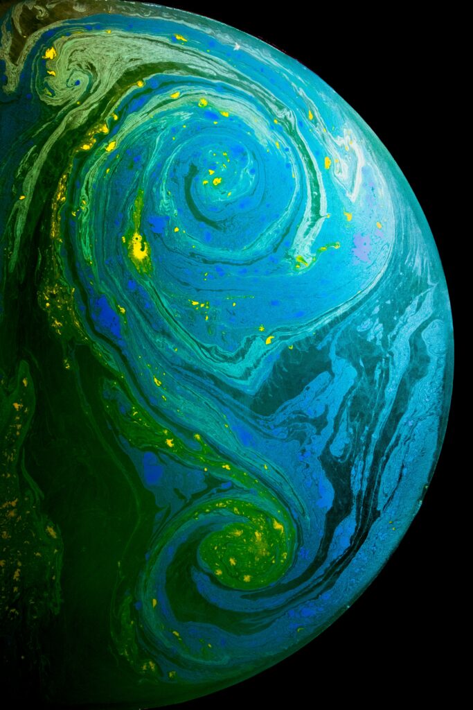 Vivid Abstract Blue-Green Wallpaper with Celestial Patterns