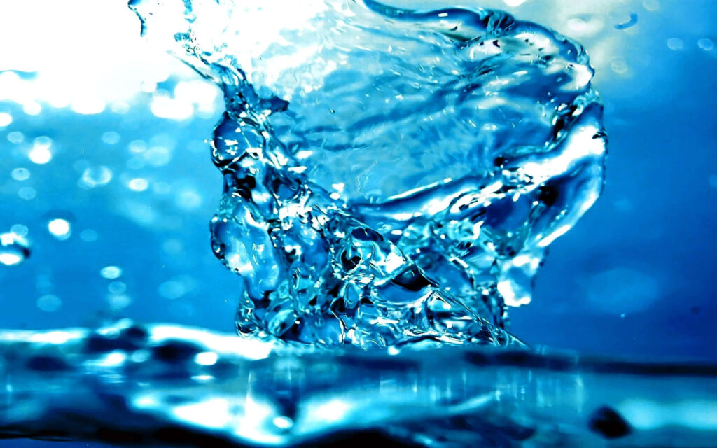 Vivid Blue Water Splash Wallpaper: Mesmerizing Abstract Background