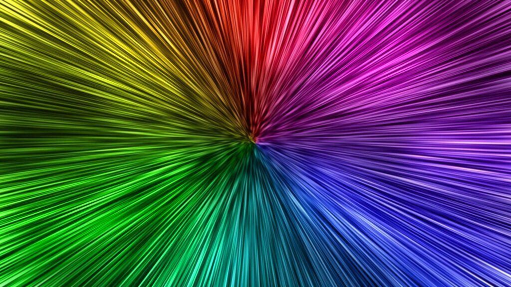 Vibrant dye wallpaper with dynamic colorful burst radiating green yellow red purple and blue tones