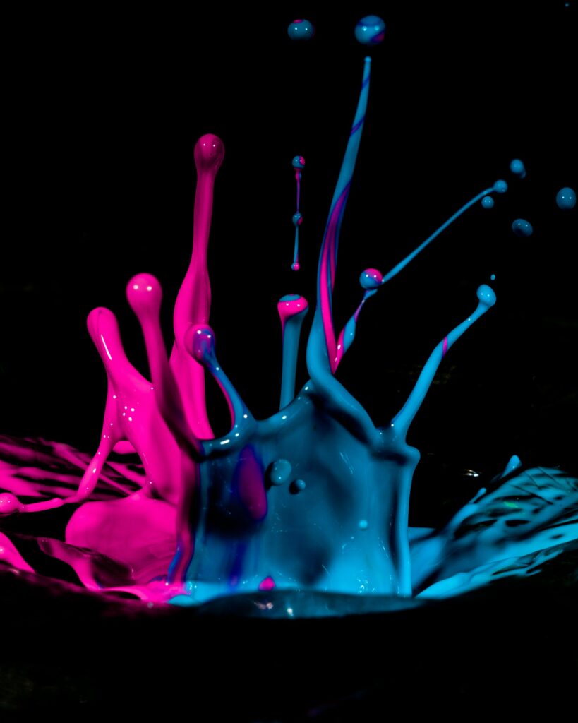 Dynamic Pink and Blue Paint Splash - Vivid Macro Wallpaper Background