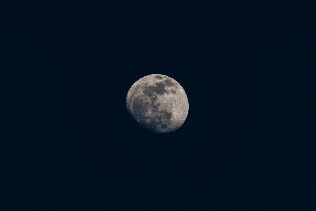 Serene Moon Wallpaper: Vivid Glow in Dark Night Sky - Minimalist Space Art