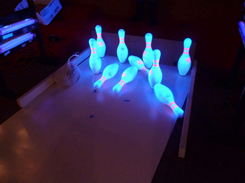 Vivid bowling wallpaper showing perfect strike with glowing pins neon lights in lively alley