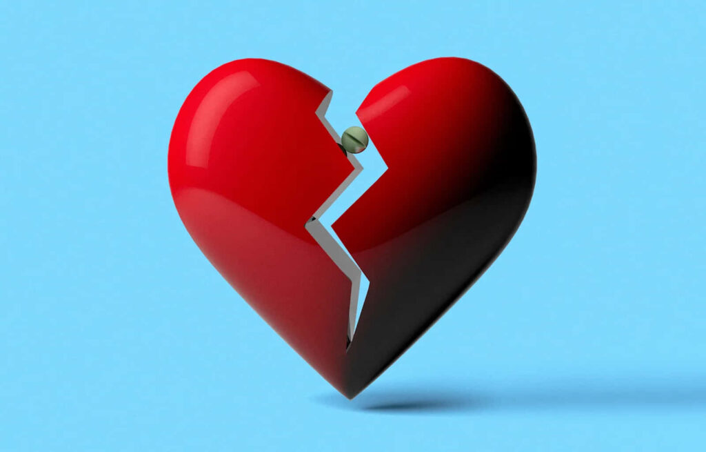 Reflective Red Broken Heart Wallpaper on Blue Background