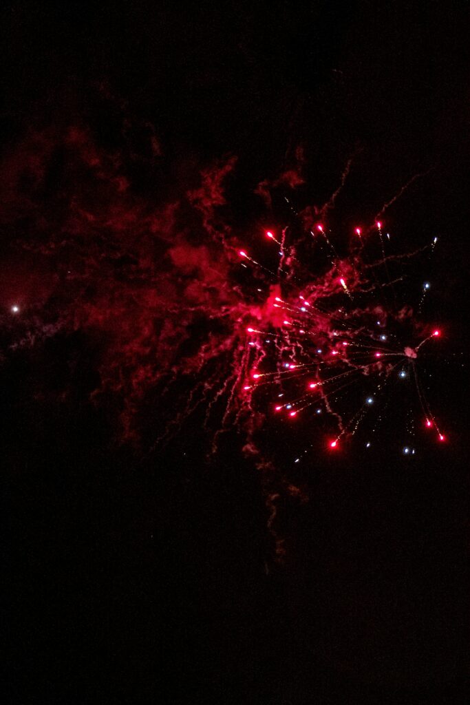Vivid Red Fireworks Wallpaper - Stunning Night Sky Display