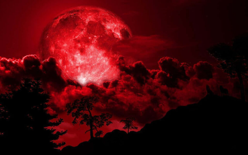 Vivid Red Moon Wallpaper: Mysterious Sky with Dramatic Clouds