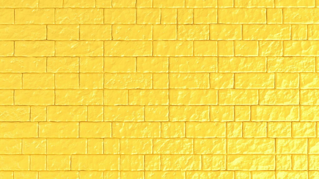 Vibrant Yellow Bricks: HD Wallpaper of a Textured Brick Wall