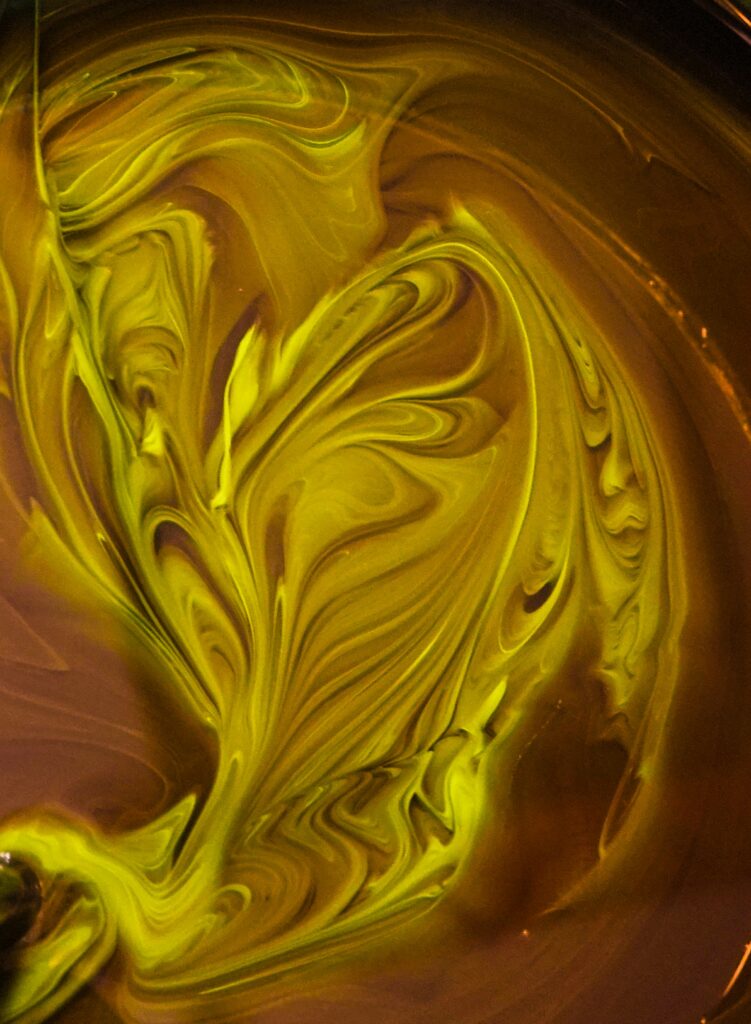 Vivid Yellow Fluid Art Wallpaper - Dynamic Abstract Background Design