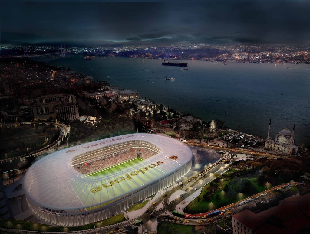 Night aerial view of illuminated Vodafone Arena Istanbul near Bosphorus with historic Dolmabahçe Mosque Wallpaper