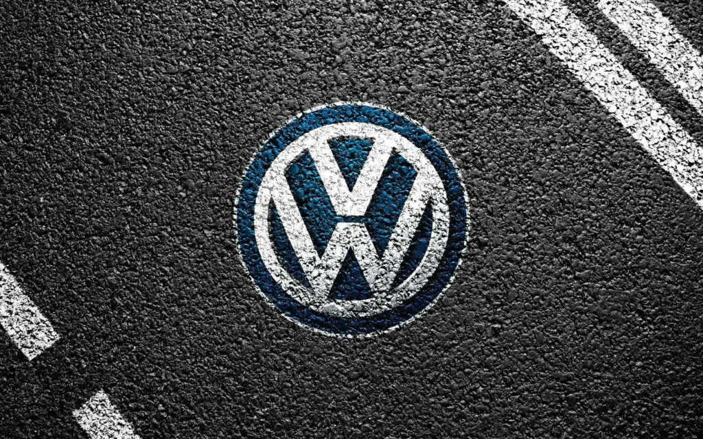 Volkswagen Logo Wallpaper on Textured Asphalt - Driving Excellence