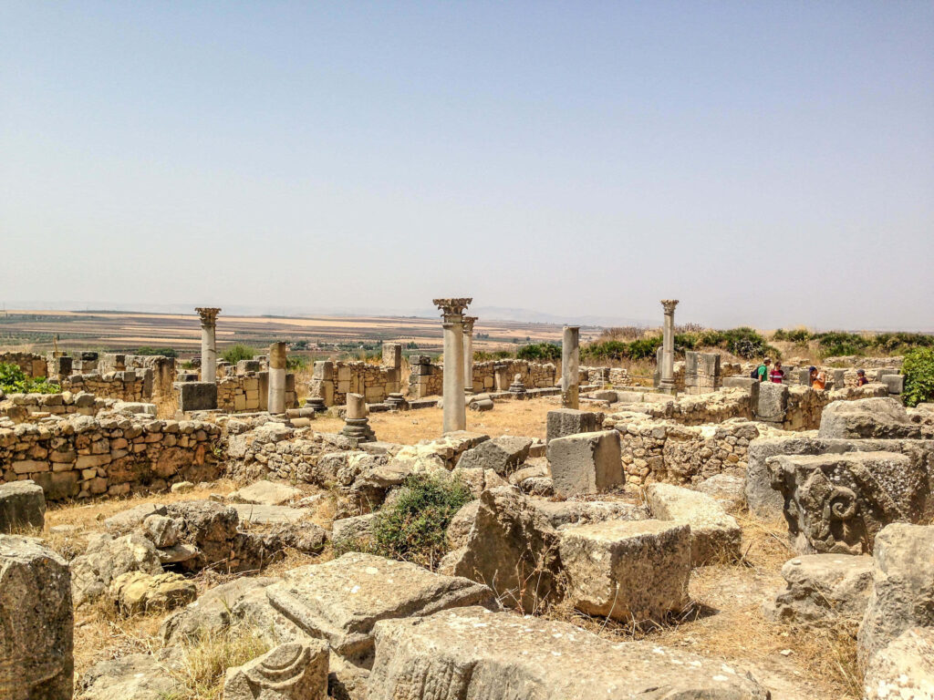 Ancient Ruins of Volubilis Wallpaper: Stone Structures & Columns