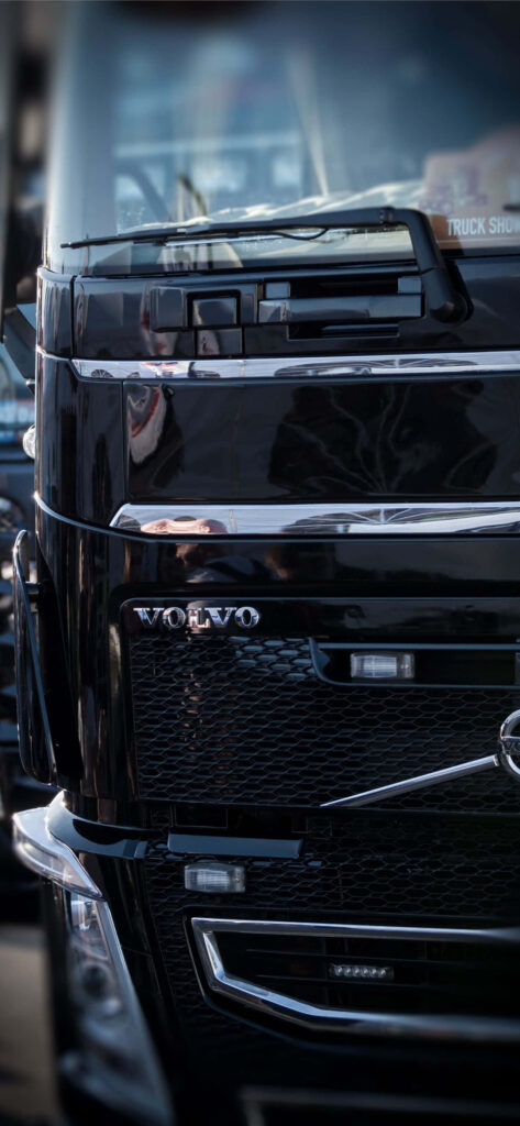 Volvo truck front view wallpaper showcasing sleek design and rugged durable build background