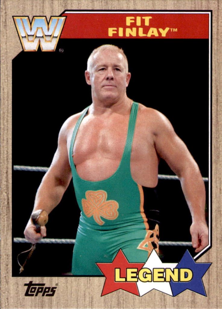 WWE Topps Fit Finlay trading card wallpaper in green singlet with shamrock and shillelagh ring pose