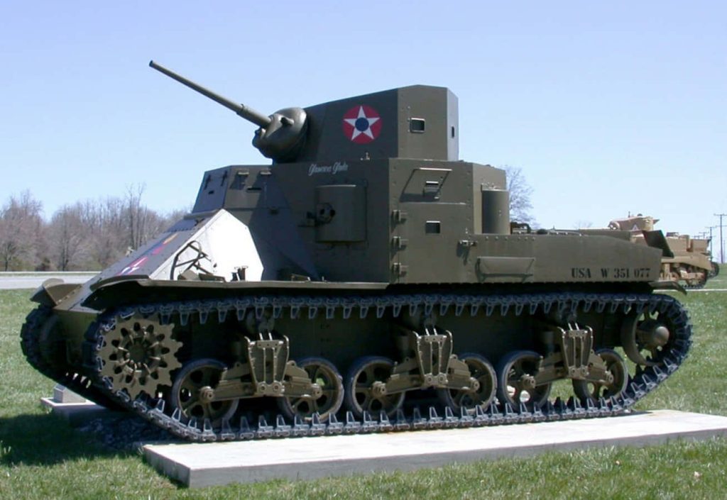 WWII M3 Lee medium tank in olive drab with US markings on display under clear blue sky Wallpaper