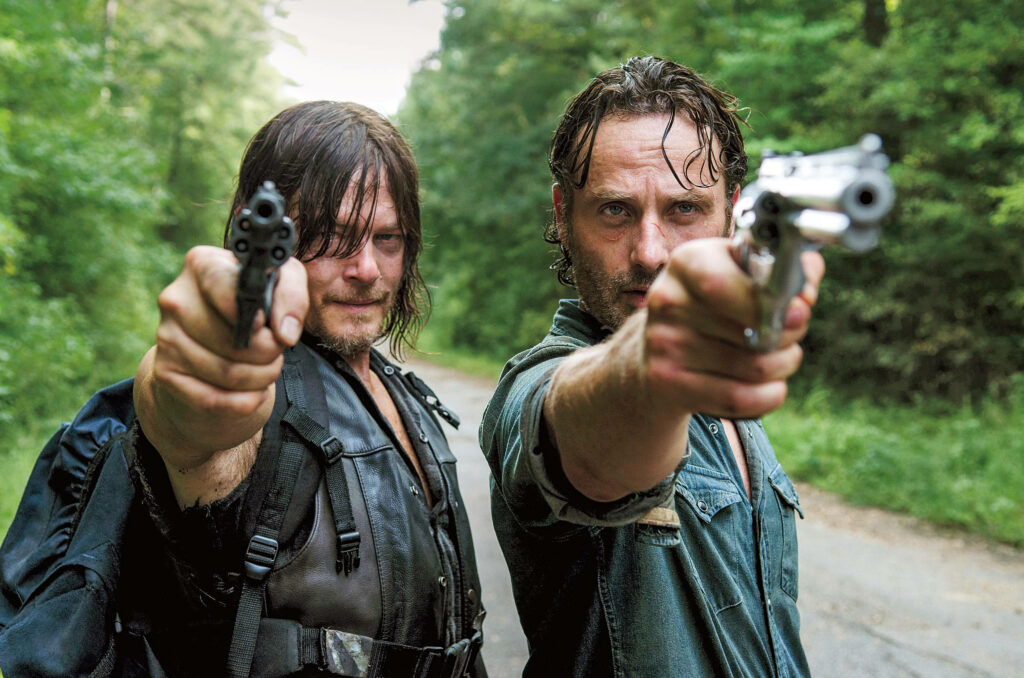 Walking Dead Character Wallpaper: Intense Revolver Aiming in Forest