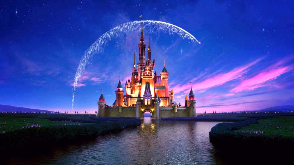 Walt Disney World Cinderella Castle glowing at twilight with fireworks and moat reflection wallpaper