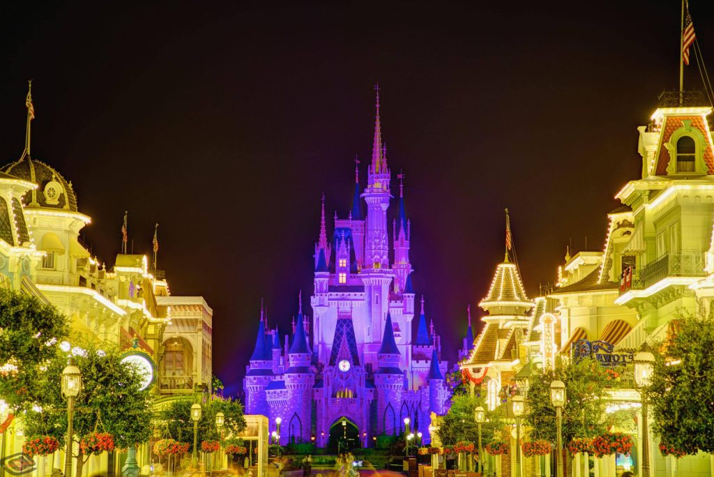 Walt Disney World night view Main Street USA Cinderella Castle purple lights golden glow wallpaper