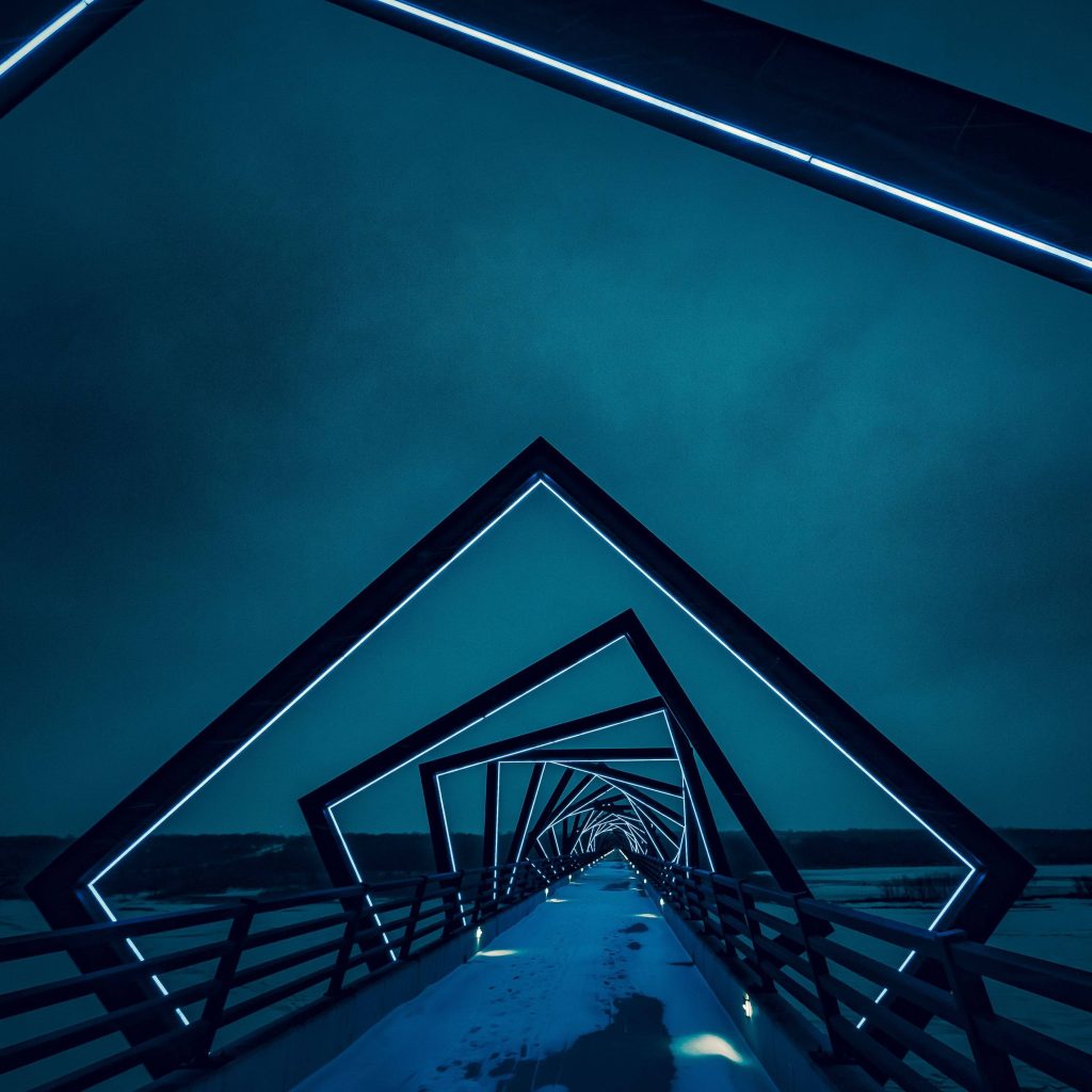 Walterdale Bridge Edmonton at night glowing geometric arches snow dusted pedestrian path wallpaper