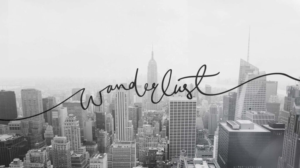 Grayscale Cityscape Wallpaper with 'Wanderlust' - Adventure Awaits
