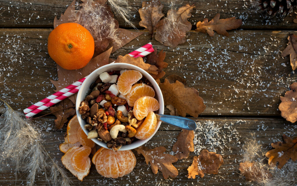 Cozy Autumn Wallpaper: Healthy Snack Bowl with Nuts & Fruits