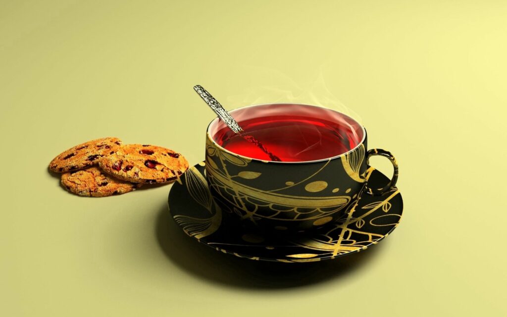 Elegant Black & Gold Teacup Wallpaper with Red Tea & Cookies