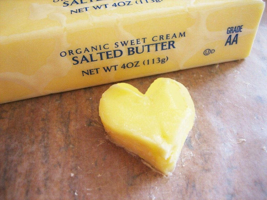 Heart-Shaped Salted Butter Wallpaper on Wooden Surface Background