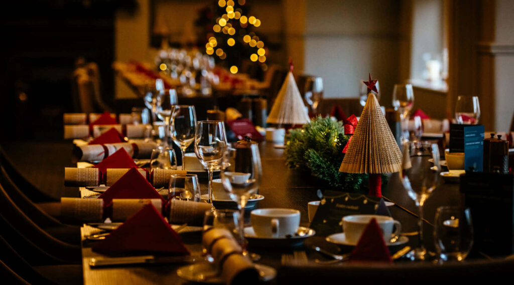 Festive Christmas Party Wallpaper with Red & Gold Decor Background
