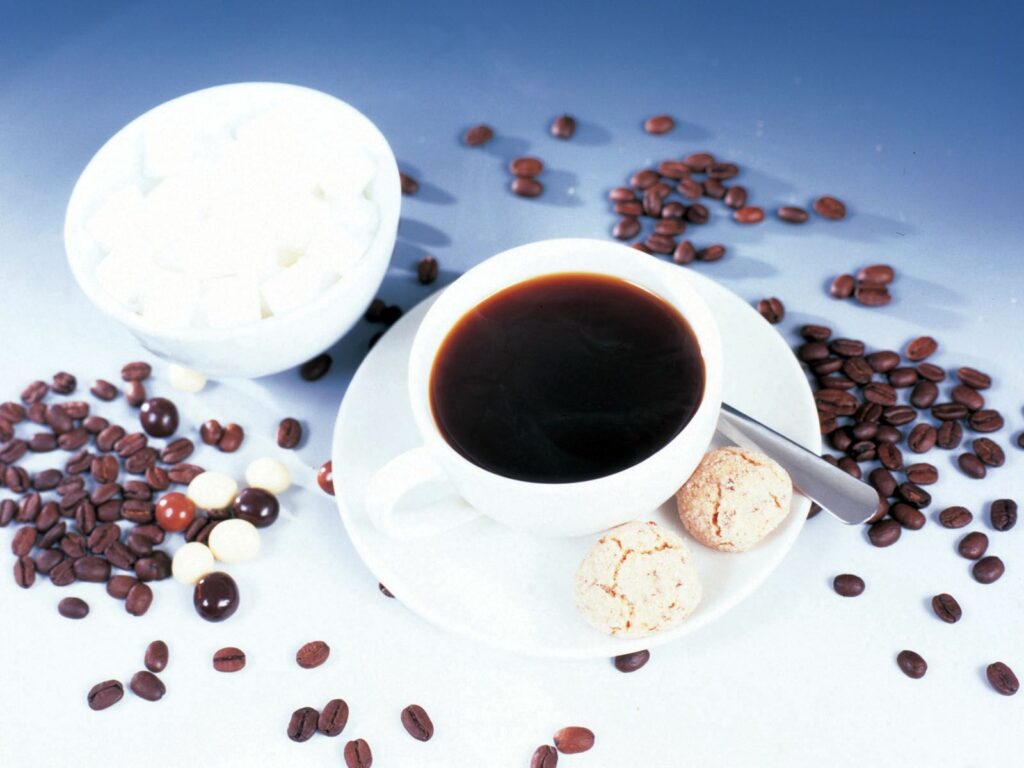 Cozy Coffee Scene: Warm Cup, Cookies, Beans & Sugar Bowl Wallpaper